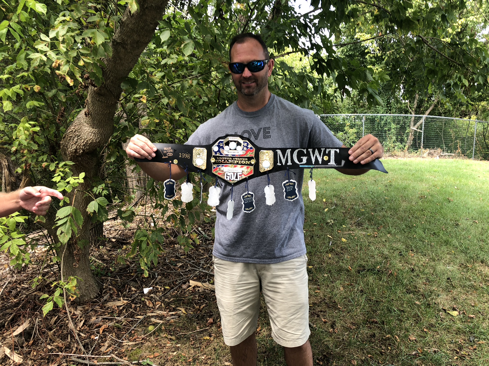 A champion holding the MGWT championship belt